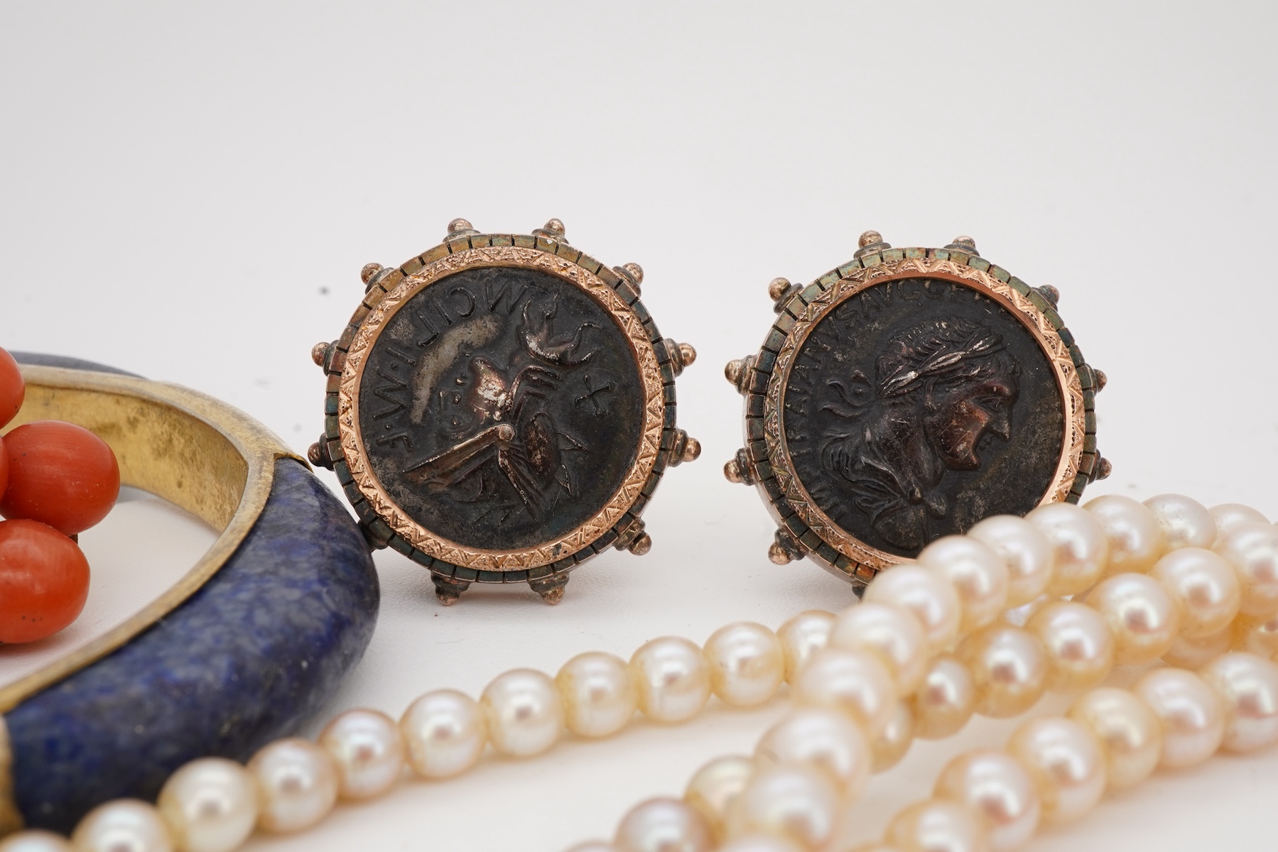 A collection of jewels including a coral demi-parure, comprising: a coral necklace and pair of earrings, lengths 46 and 2.5cm respectively, necklace clasp stamped 14K, earrings with post fittings; a carnelian fob seal wi